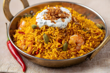 Fototapeta premium Delicious seafood paella with shrimp and fried onions