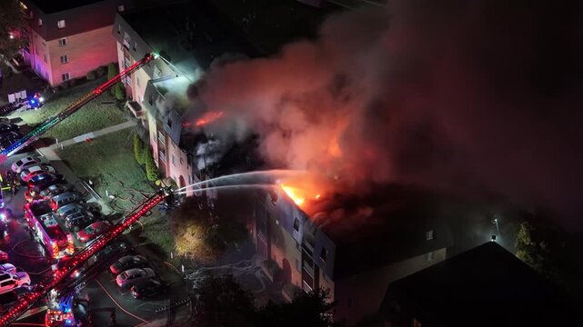 Aerial View of Firefighters Fighting a Multi-Alarm Fire at an Apartment Complex