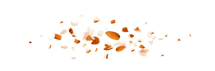Crushed almonds falling isolated, flying nut pieces, levitate scattered almond seeds