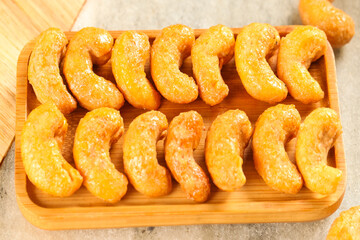 Crispy Vietnamese Salt-Baked Cashew Nuts in Wooden Tray - Golden Fried Kernels Snack Food