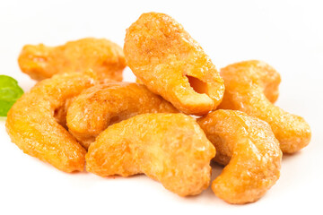 Crispy Fried Vietnamese Cashew Nuts with Salt Coating on White Background