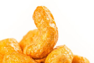 Roasted Vietnamese Cashew Nuts - Golden Crispy Salt-Baked Kernels on White Background