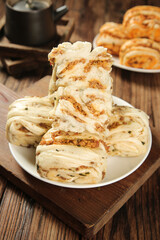 Handmade Scallion Pancake Rolls Stacked on Plate - Traditional Asian Savory Pastry