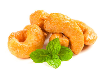Roasted Vietnamese Cashews with Mint Garnish - Golden Crispy Nuts on White Background