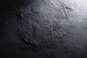 Textured grayscale surface, lit dramatically, showing rough layers and shadows