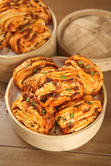 Handmade Spicy Meat Rolls in Bamboo Steamers - Traditional Asian Dim Sum Buns