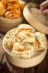 Handmade Steamed Meat and Scallion Buns in Bamboo Steamers - Traditional Asian Breakfast Rolls