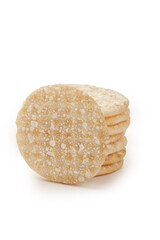 Crispy Puffed Rice Cakes Stack with White Granules on White Background