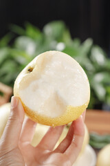 Fresh White Crown Pear Slice in Hand - Sydney Fruit Display Picture