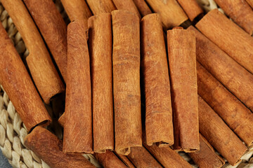 Natural Cinnamon Sticks Spice Rolls from Guangxi in Wicker Basket for Cooking and Seasoning