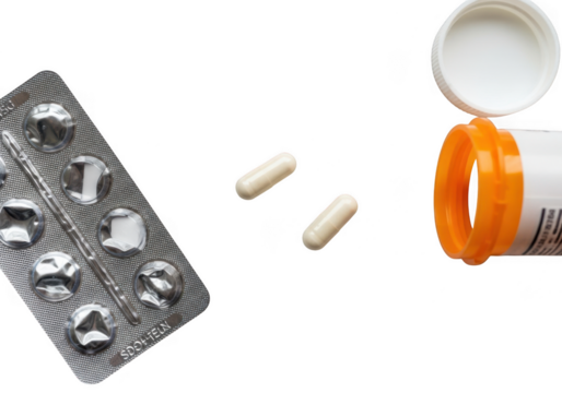 A blister pack of pills and two loose capsules next to an open prescription bottle, isolated on transparent background