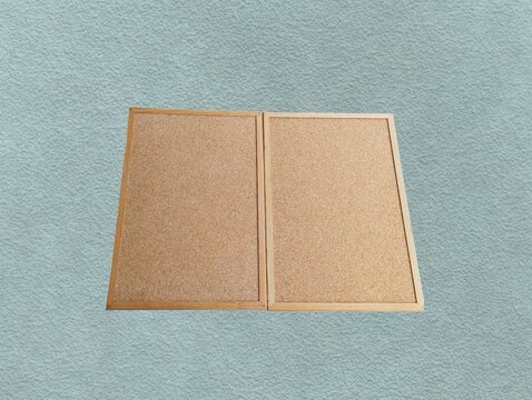 The green background in the image is a brown sticky whiteboard with sturdy edges, used for hanging or placing pins to show work on the board from soft brown wood, soft wood texture Beautiful.
