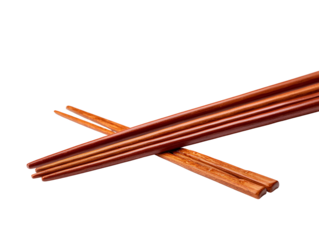 A pair of wooden chopsticks crossed against a deep black background