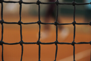 Close-up of Tennis Net on Clay Court &ndash; Focus, Precision and Determination Concept