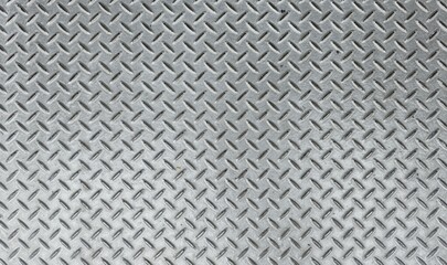 Silver steel floor. Silver steel diamond plate pattern background texture. Close-up abstract of...