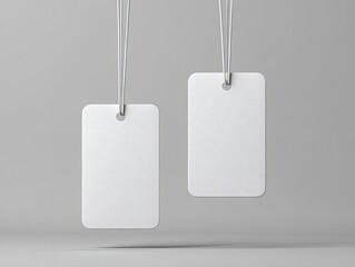 Two blank white rectangular tags hang from strings