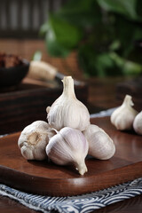 Fresh White Garlic Bulbs and Cloves on Wooden Cutting Board - Kitchen Cooking Ingredients