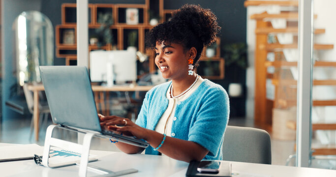 African woman, typing and laptop at house for research, finance report and data analysis. Female person, remote work or pc with paperwork, revenue graphs and financial comparison of audit information - Powered by Adobe