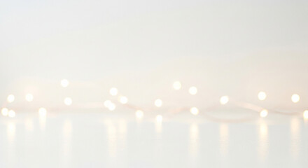 Soft, glowing fairy lights create a magical, bokeh background perfect for festive celebrations and elegant event decor, evoking warmth and joy.