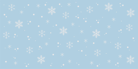 Seamless winter pattern with white snowflakes and falling snow on light blue background
