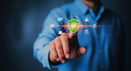 Businessman pointing at a glowing green shield icon on a virtual interface, symbolizing cybersecurity and data protection.