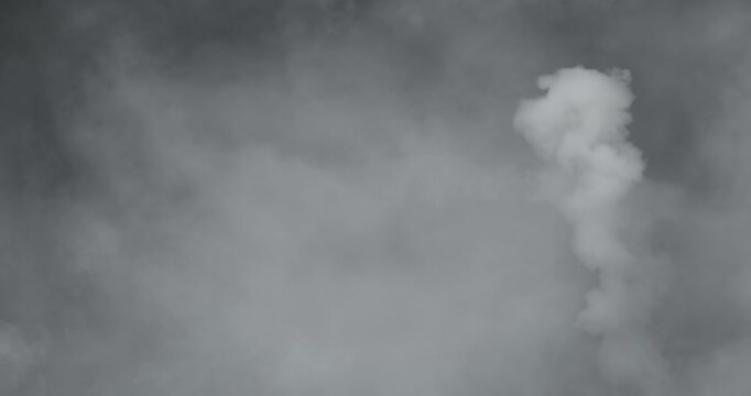 Professional 4K slow-motion VFX background of Halloween smoke and dense fog, an artistic spooky element for horror intros, eerie overlays, and cinematic visual storytelling projects.