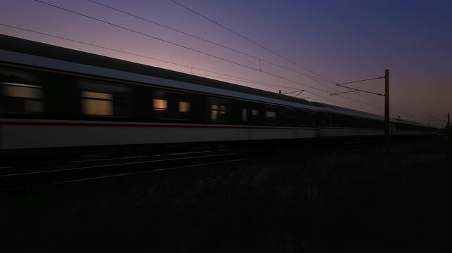Timelapse with german passengers train traveling at sunrise 
