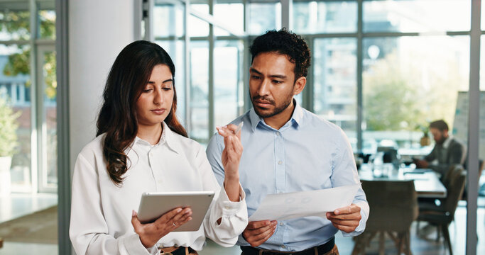 Documents, tablet and business people in meeting for finance review, discussion and budget planning. Office, corporate team and woman with man on digital tech, paperwork and online financial report