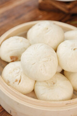 Fresh Handmade Steamed Meat Buns in Bamboo Steamer - Traditional Asian Dim Sum Dumplings
