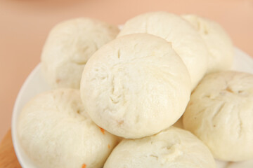 Fresh Handmade Steamed Meat Buns in White Bowl - Traditional Asian Dumplings