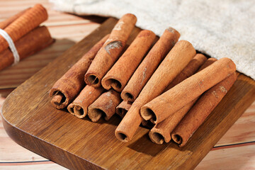 Natural Cinnamon Sticks on Wooden Board - Aromatic Spice Seasoning from Guangxi