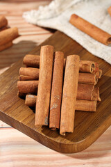 Natural Cinnamon Sticks on Wooden Board - Aromatic Spice Seasoning for Cooking