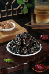 Handmade Black Sesame Seed Energy Balls Ready to Eat Healthy Diet Snack with Nuts and Cranberries