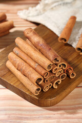 Guangxi Cinnamon Sticks Natural Aromatic Spice on Wooden Board for Cooking and Seasoning