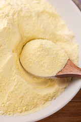 Freshly Ground Rice Flour in Bowl with Wooden Spoon - Gluten Free Baking Ingredient