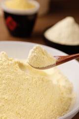 Freshly Ground Rice Flour in Wooden Spoon - Gluten-Free Baking Ingredient