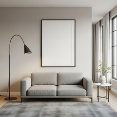 Modern living room with minimalist grey sofa, blank frame, and floor lamp