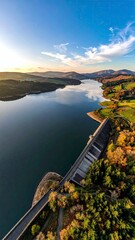 Panoramic View of Tranquil Lake and Lush Landscape.