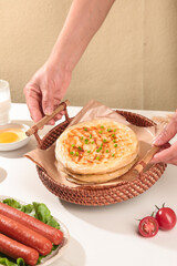 Traditional Handmade Scallion Pancakes in Wicker Basket with Fresh Ingredients