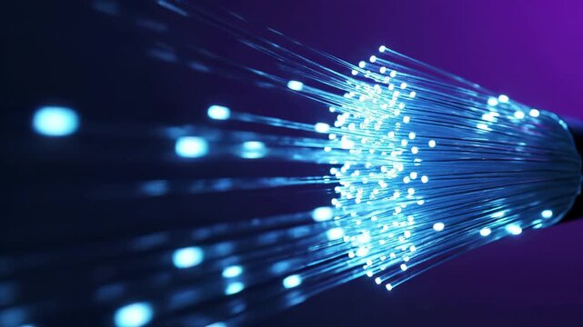 Fiber optic cable bundle glows with blue and purple light. Speed internet and broadband network infrastructure transmits digital data through illuminated telecommunication strands with fast