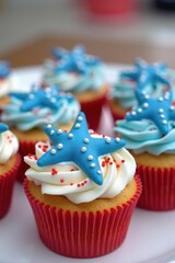 Delicious cupcakes decorated with blue starfish and sprinkles