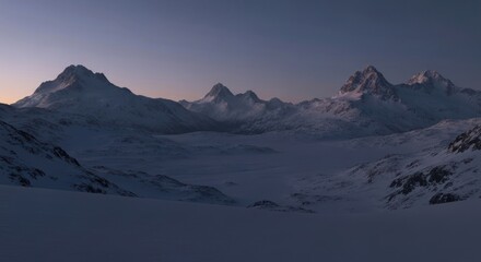 Majestic, snow-covered mountain range at dawn or dusk, bathed in soft light