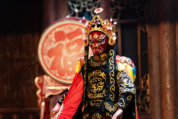 Chinese actor performs a public traditional changing face performance onstage in Chengdu, China