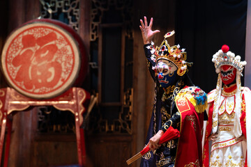 Chinese actor performs a public traditional changing face performance onstage in Chengdu, China