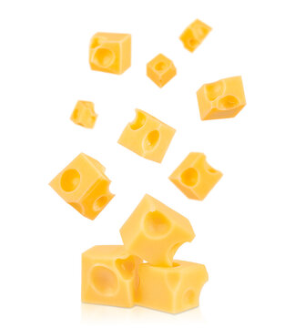 Falling cubes of Swiss cheese with round holes isolated on white background, dairy product concept with copy space for text, ideal for advertising, banner, or food design template