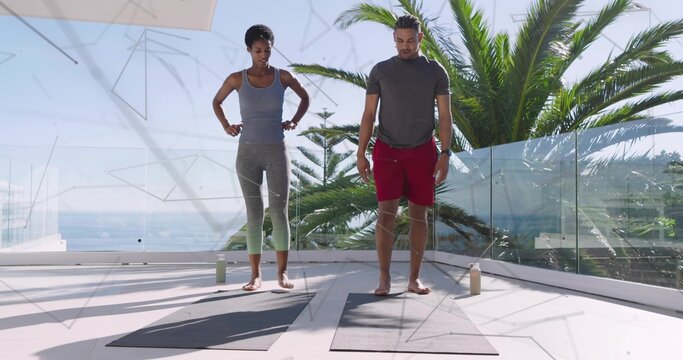 Stretching workout partners in sportswear on coastal terrace with yoga mats and water - Powered by Adobe