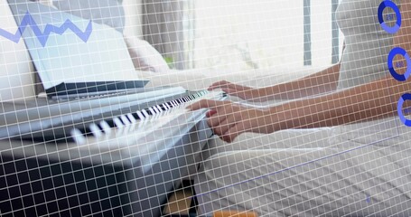 Playing woman in pale top pressing keys on keyboard by window, with laptop and blue overlays