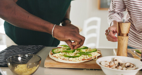 Hands, people and cooking pizza at house with meal prep, organic ingredients and healthy food. Friends, help and vegetables toppings for garnish, Italian cuisine and culinary skills of homemade lunch