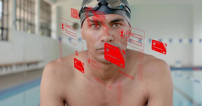 Standing bare-chested male swimmer wearing black swim cap and goggles at pool, with red holograms