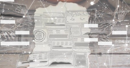 Studying hands in knit sleeves holding torn document with stamp on wood tabletop, digital overlay